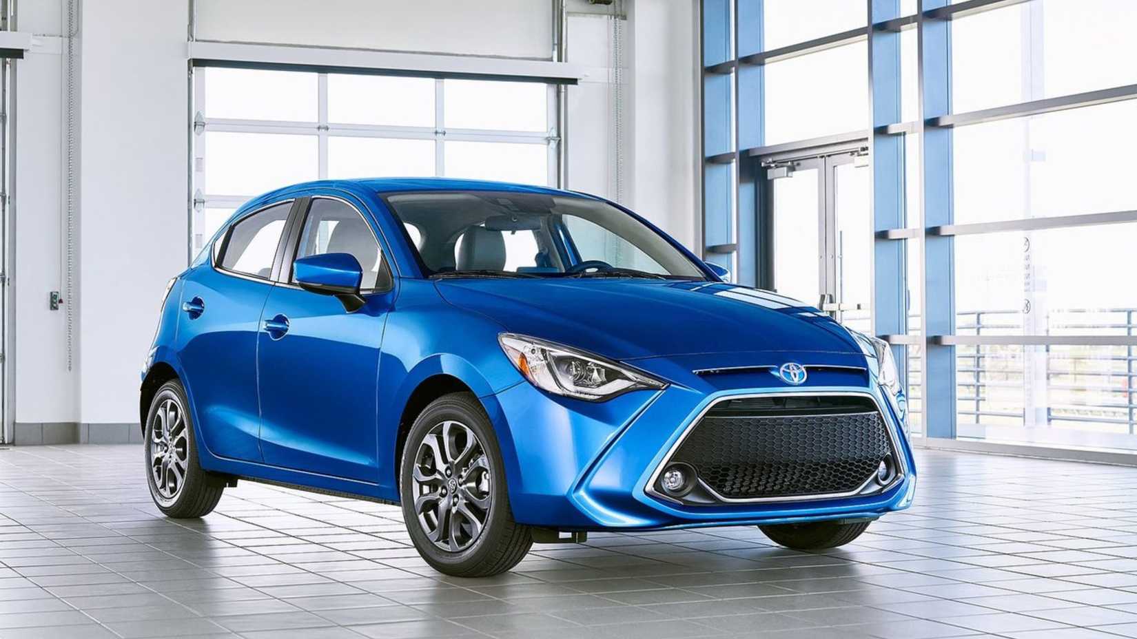 Static front 3/4 shot of a blue 2020 Toyota Yaris Hatchback.