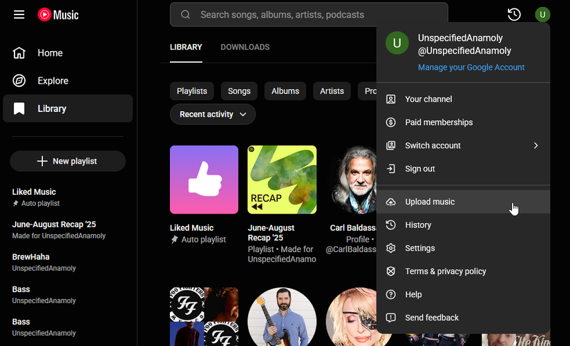 A screenshot of YouTube Music with the settings menu open. Upload music is highlighted.