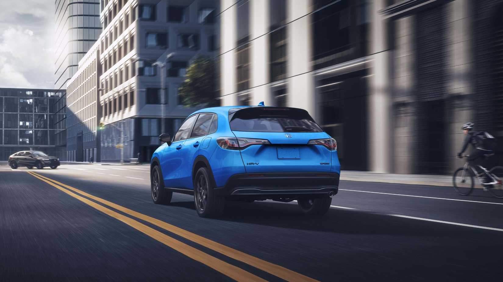 Dynamic rear 3/4 shot of a blue 2026 Honda HR-V.