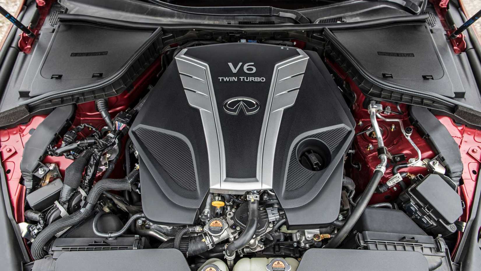 Shot of the engine under the hood of a 2016 Infiniti Q50 Red Sport 400.