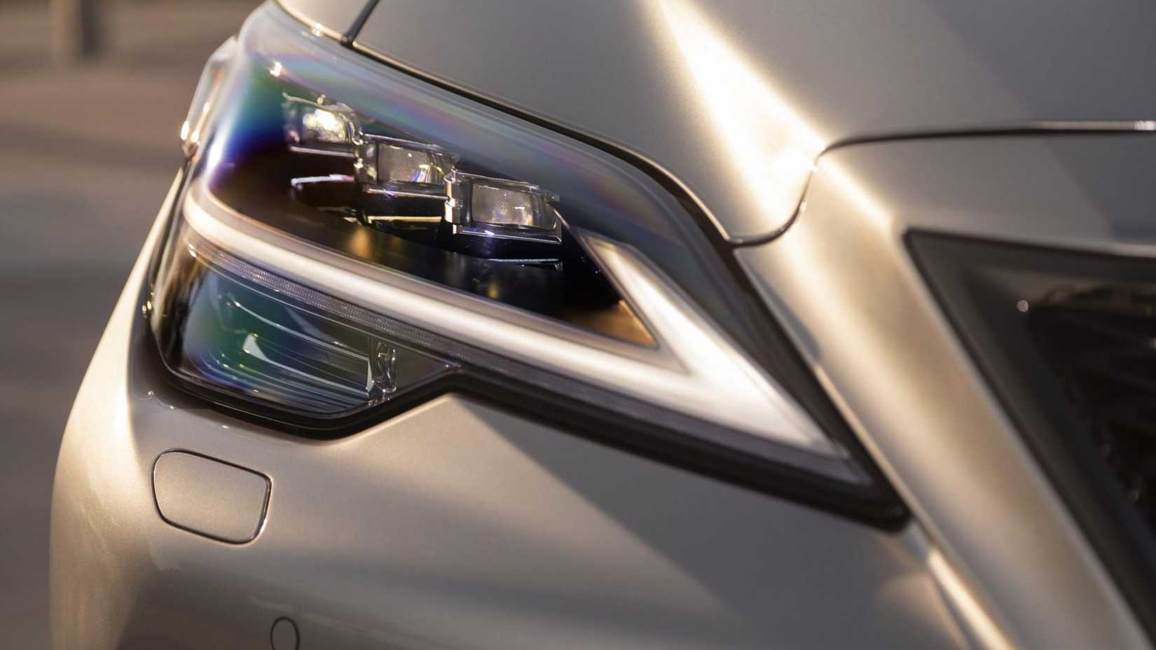 Close-up shot of the headlight on a silver 2025 Lexus LS 500 F-Sport.
