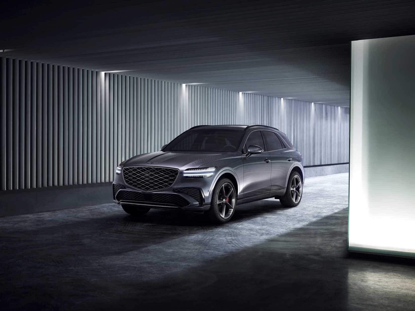 Gray 2026 Genesis GV70 parked in a warehouse 