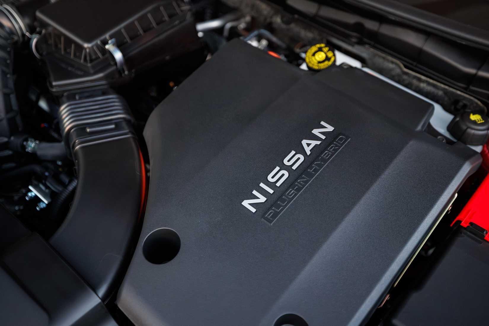 Red 2026 Nissan Rogue Plug-in Hybrid engine under the hood. 
