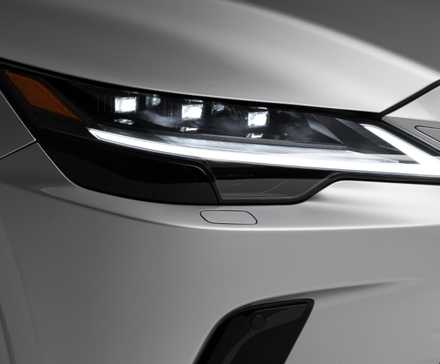 Close-up shot of the headlight on a silver 2026 Lexus RX 350 Premium.