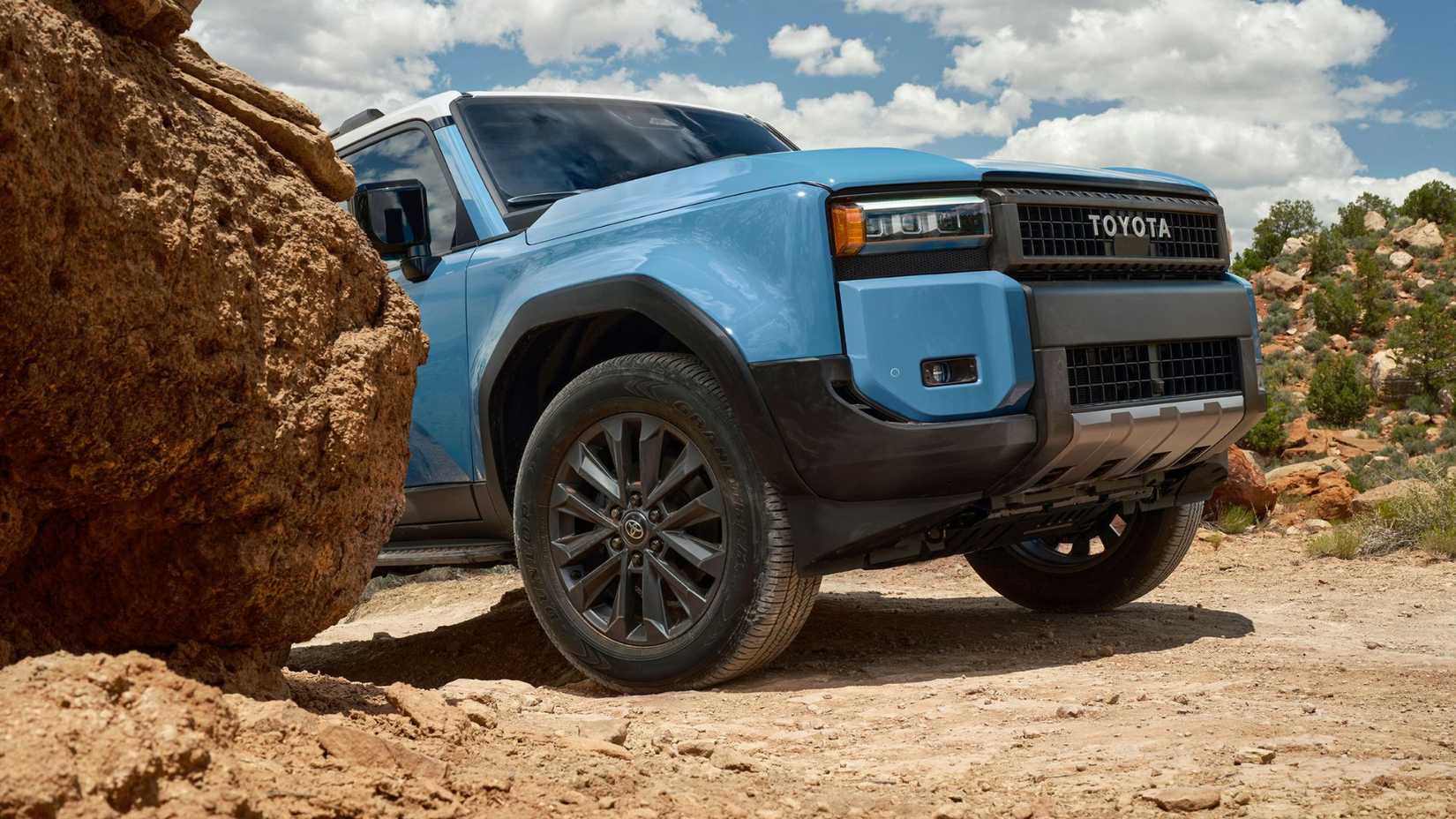 Close-up shot of the front end of a blue 2026 Toyota Land Cruiser.
