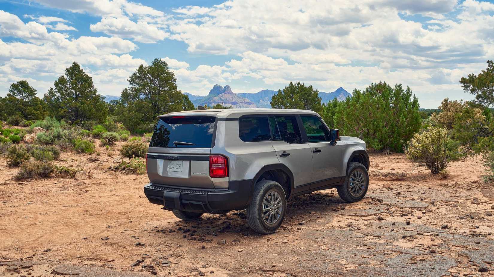 Static rear 3/4 shot of a gray 2026 Toyota Land Cruiser 1958.