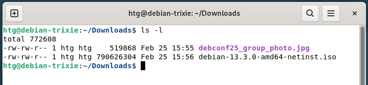 A Linux terminal showing the ls -l command showing file permissions and other info.