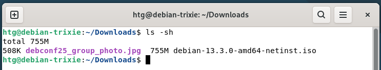 A Linux terminal showing the ls -sh command showing file sizes in human readable formats.