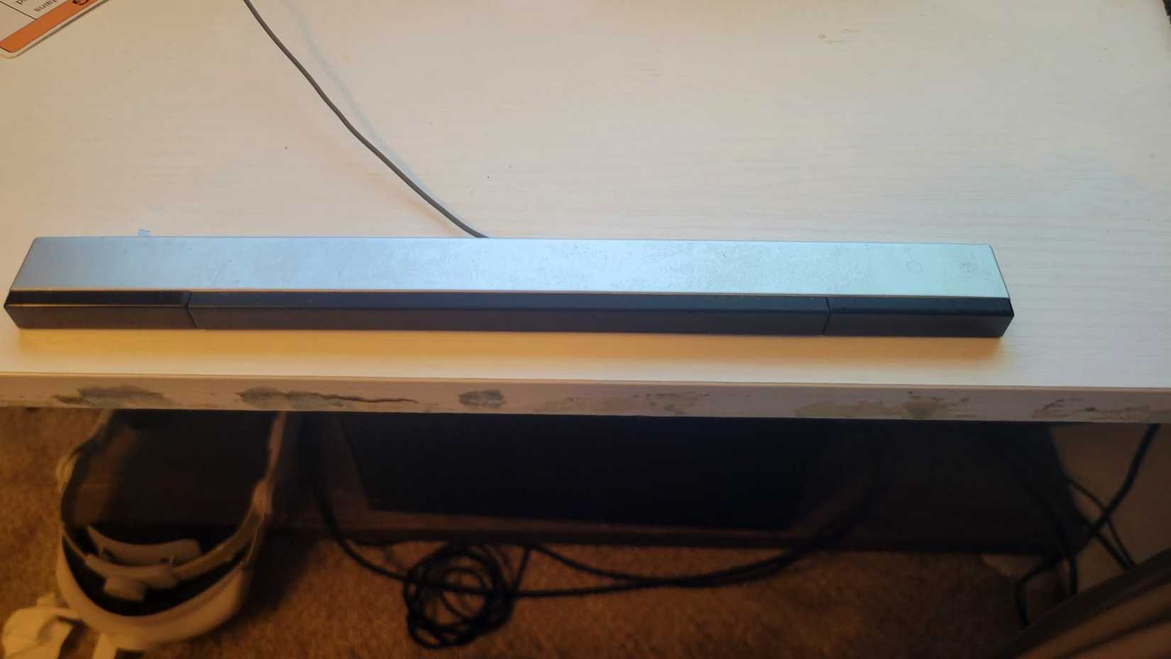 A Wii scanner on a white desk.