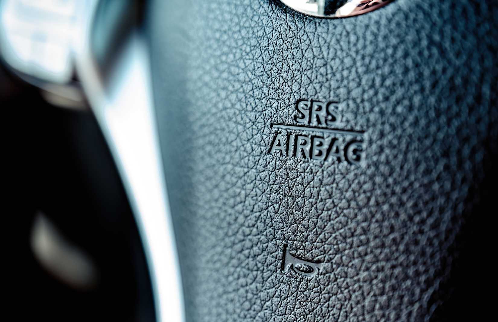 Closeup of the words "SRS Airbag" on a steering wheel