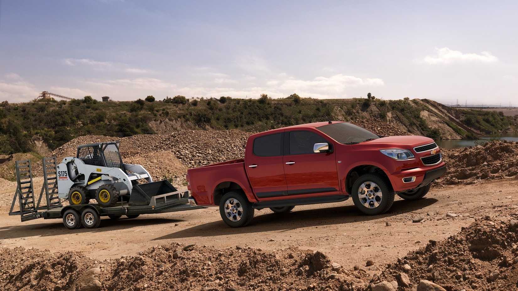 Front 3/4 action shot of a 2012 Chevrolet Colorado towing