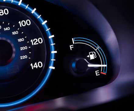 Dashboard showing a digital fuel guage near empty
