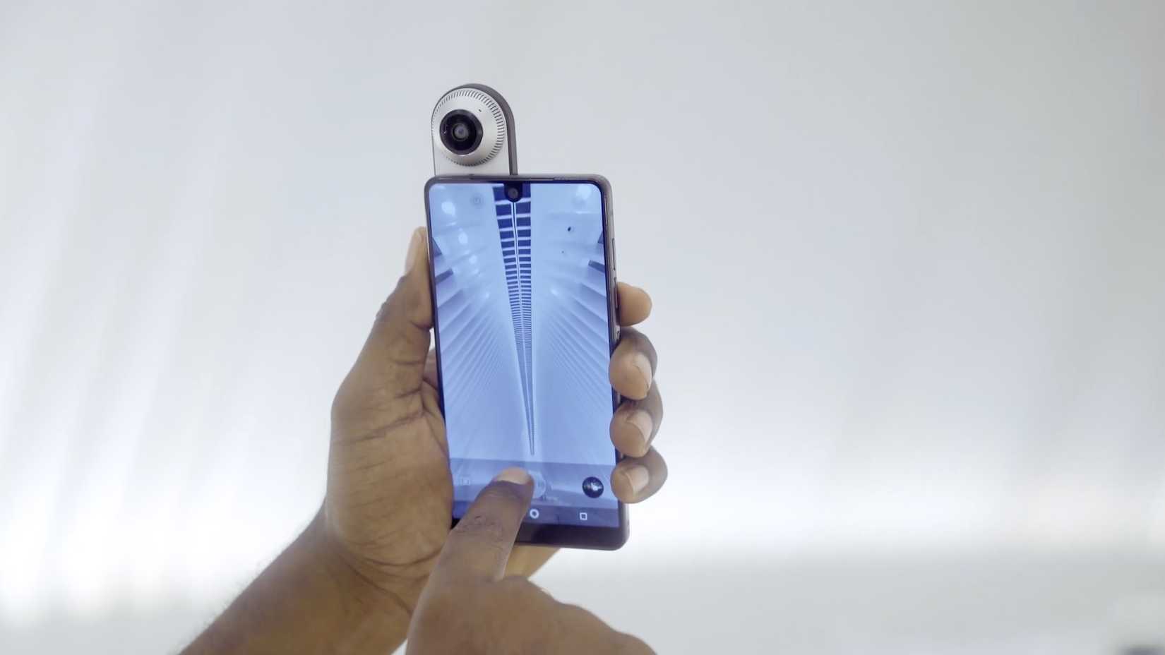 Essential Phone with its 360 camera module attached to it.