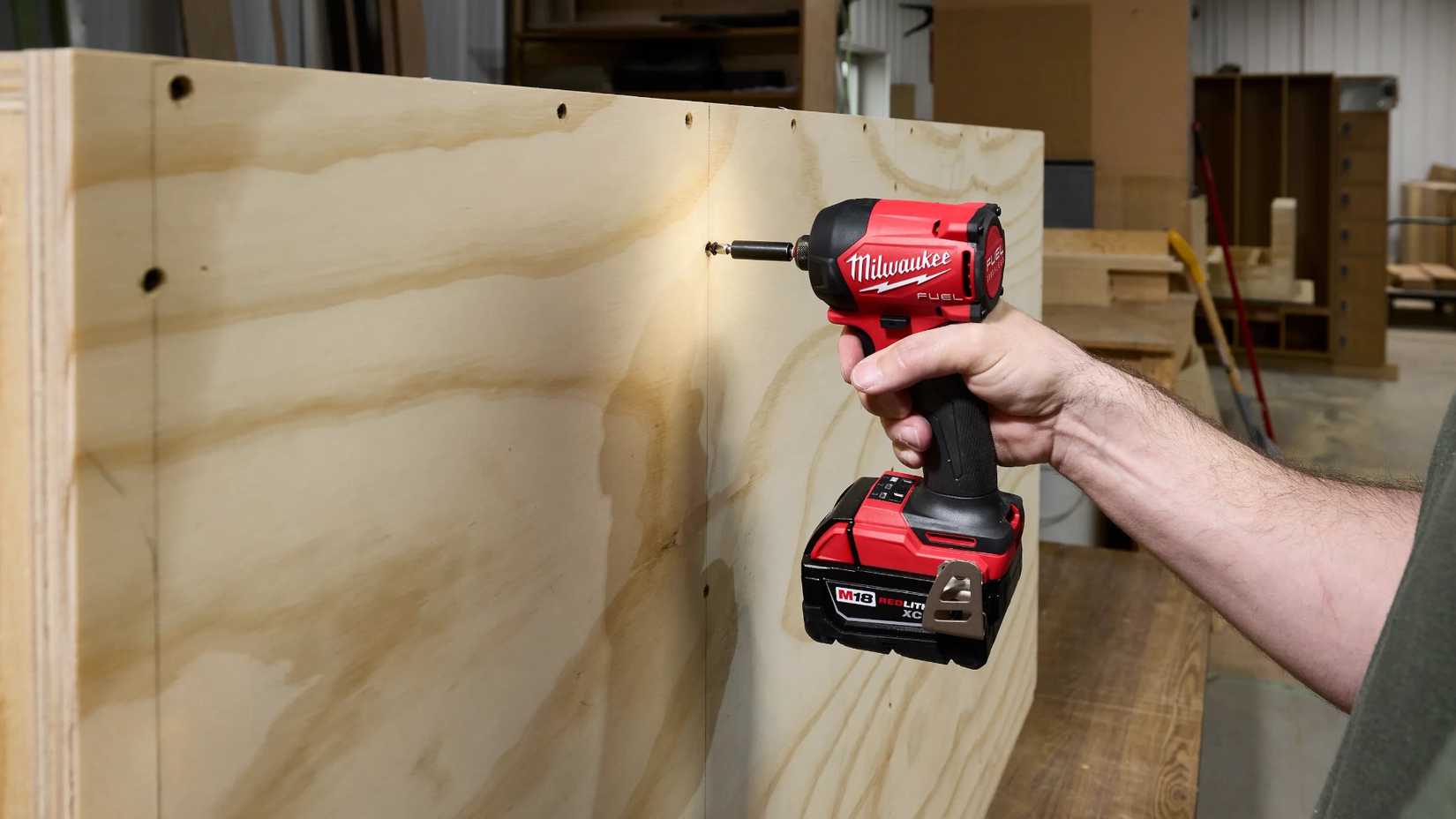 Milwaukee M18 Surge impact driver working on wood. 