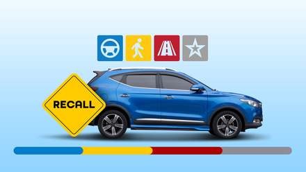 A blue SUV on a light blue background with a large yellow warning triangle in the foreground that says 'RECALL'