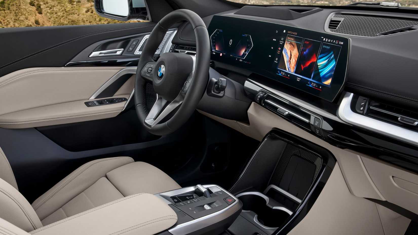 Shot of the steering wheel and infotainment screen in a 2023 BMW X1.