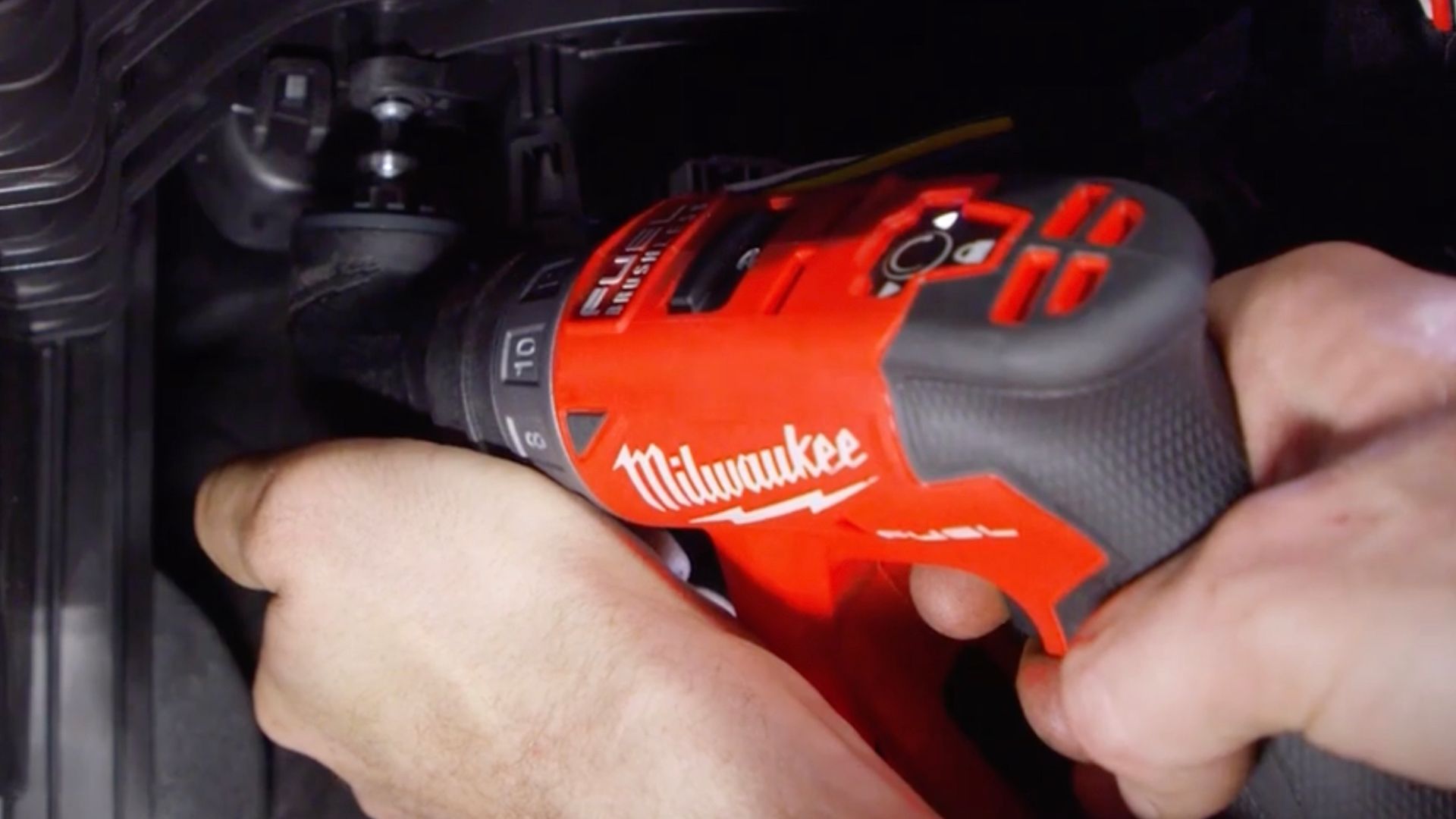 person using the Milwaukee installation driver
