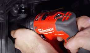 person using the Milwaukee installation driver