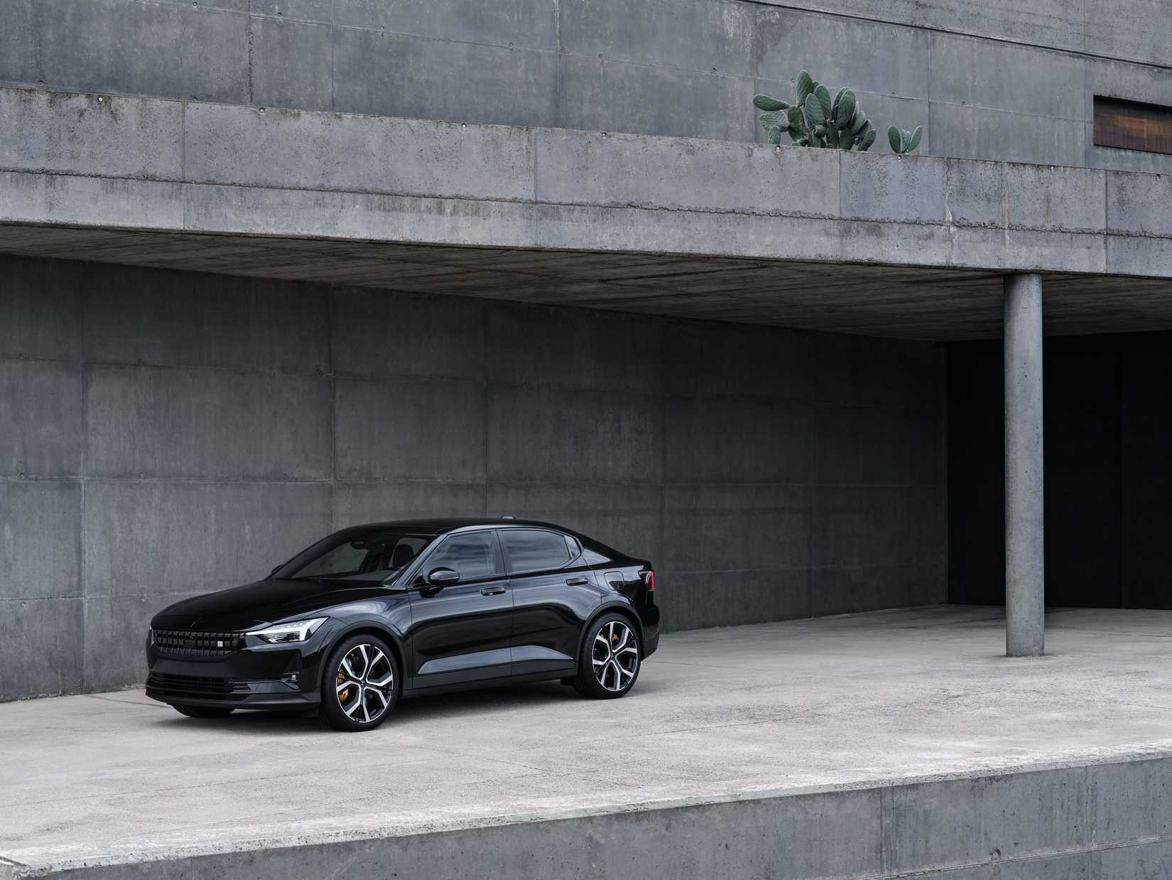 Polestar 2 parked against a concrete backdrop