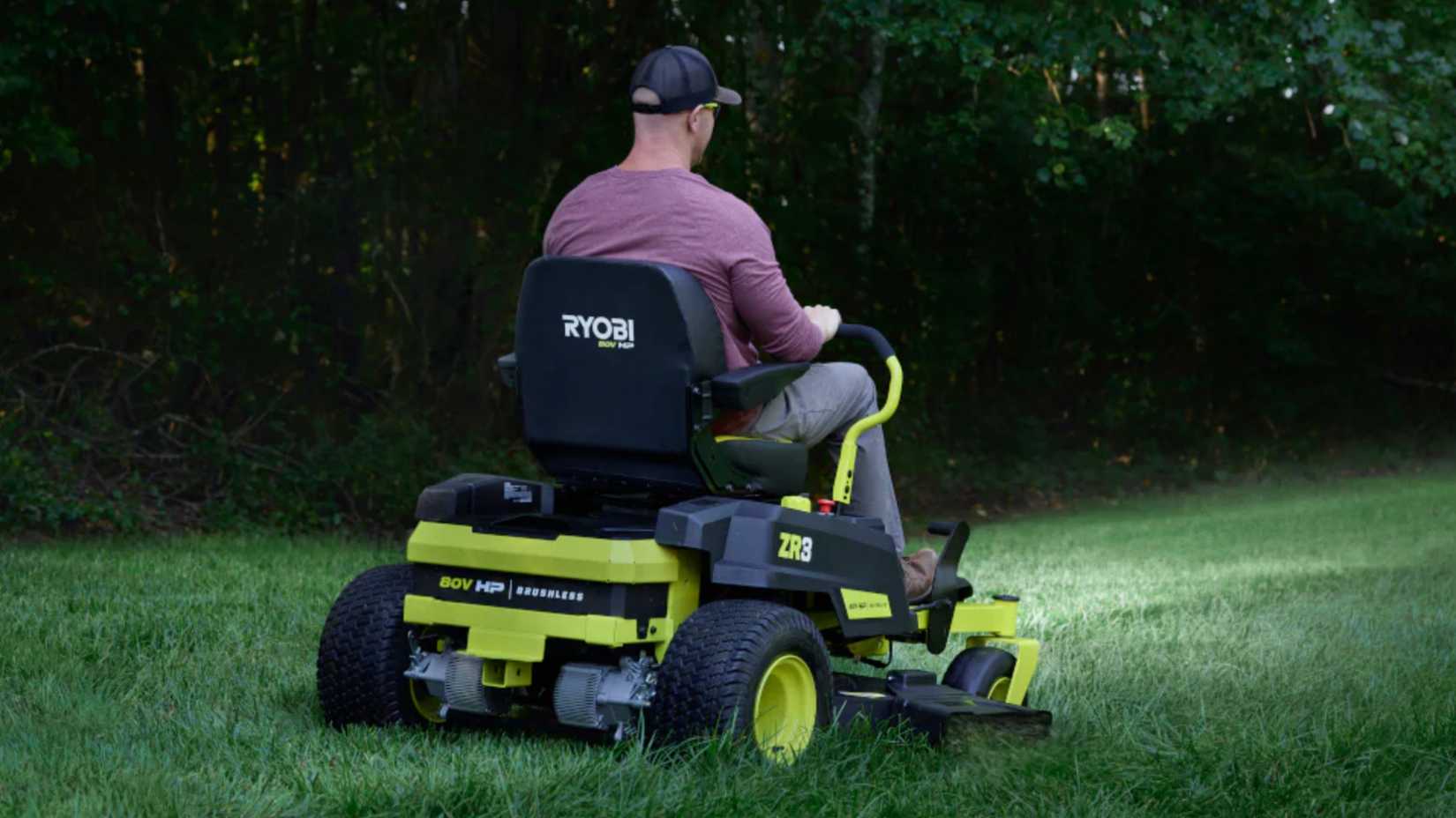 Man on a Ryobi zero-turn electric lawnmower