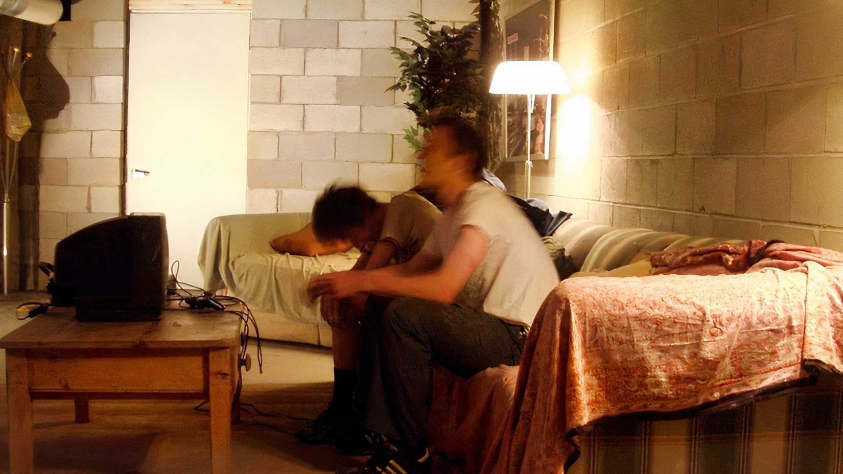 Two people in a small secret apartment.
