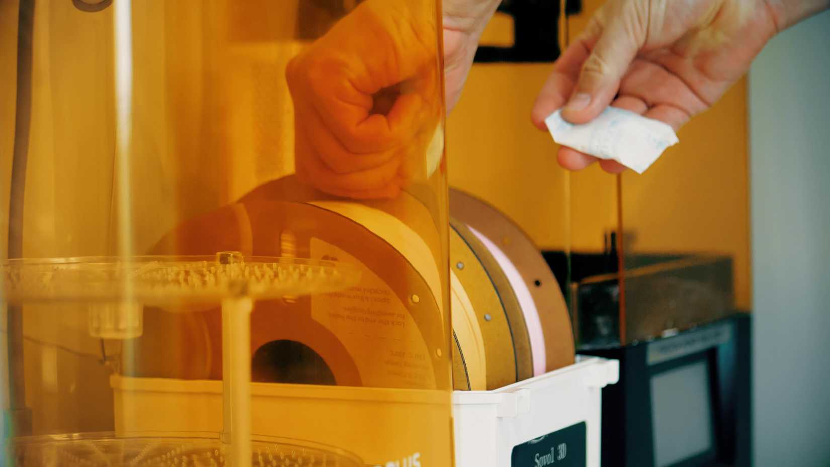 Two rolls of filament in a filament dryer box.