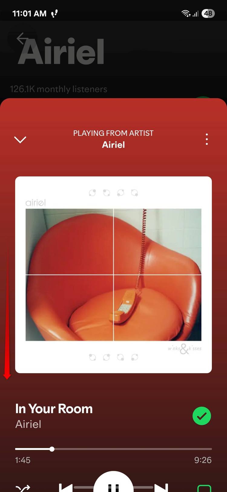 Collapsing the Now Playing screen in Spotify. 
