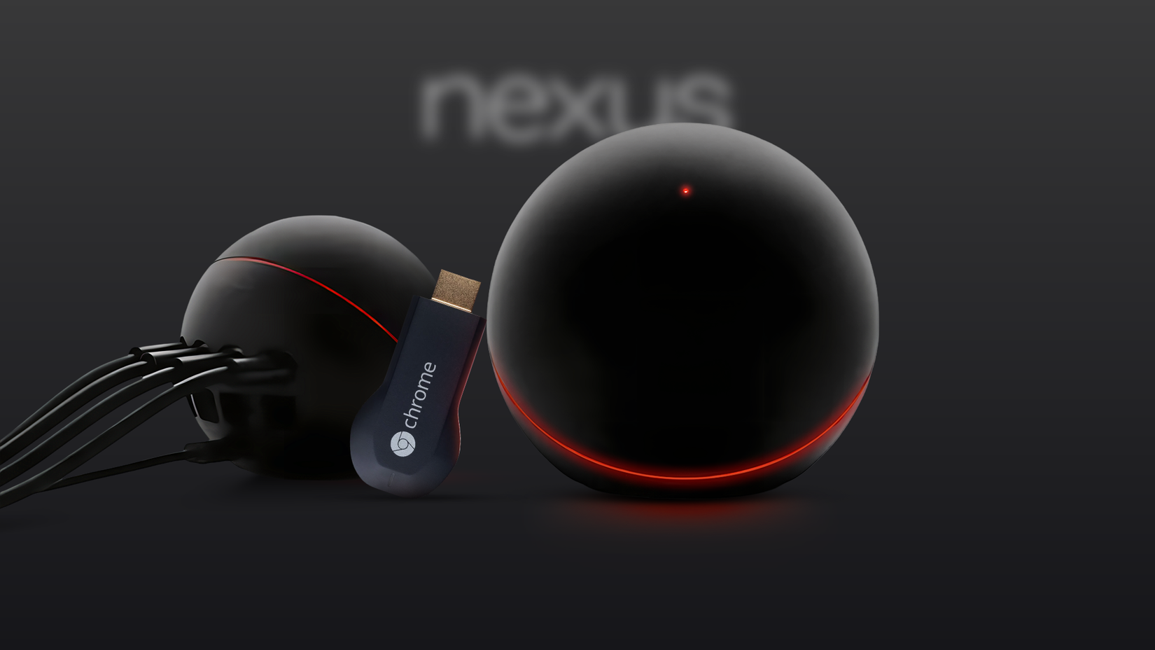 The Google Nexus Q standing next to the Chromecast dongle.