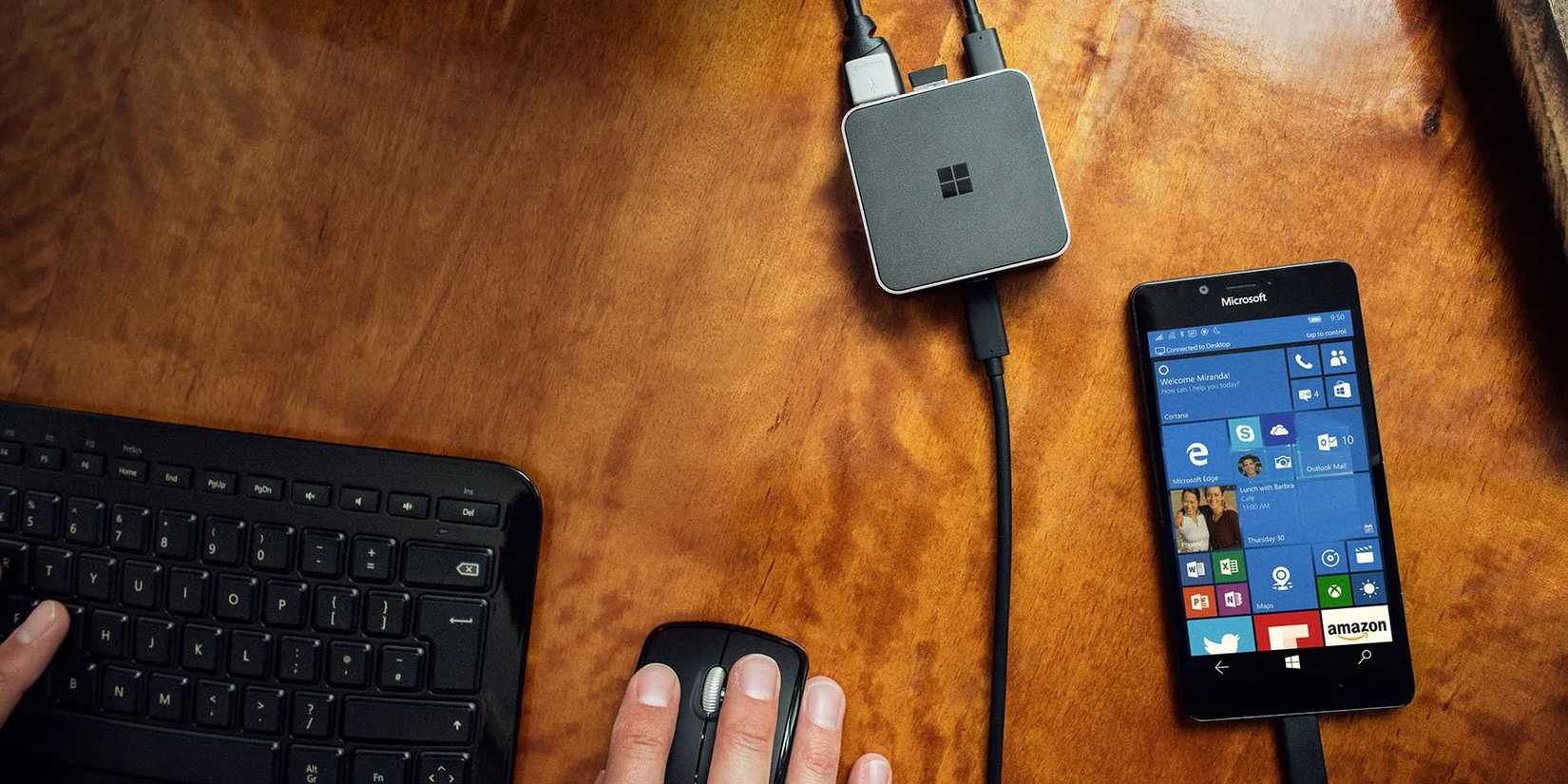 A person using their Windows 10 phone in Windows Continuum mode.