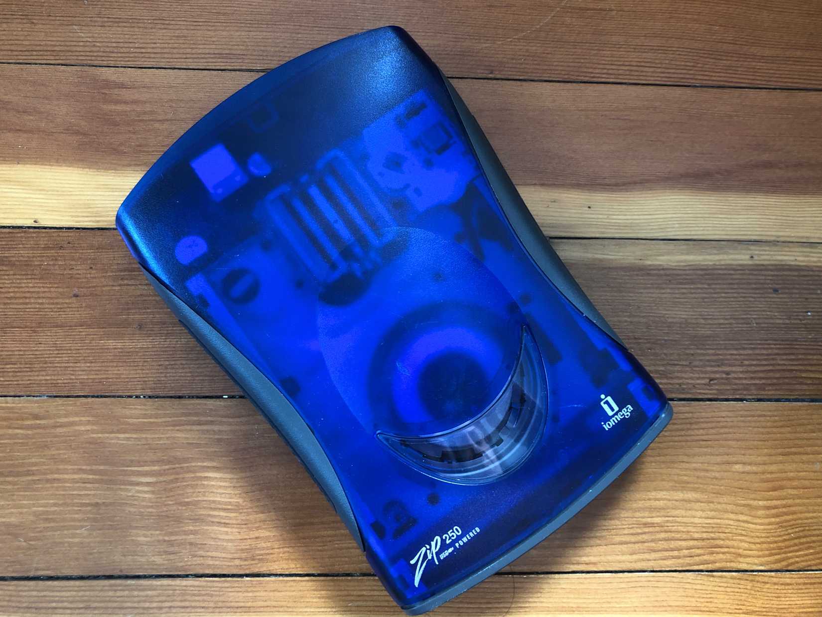 A blue Zip drive on a table.
