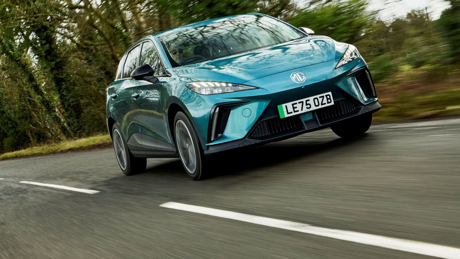 Dynamic front 3/4 shot of a blue 2026 MG4 Urban.