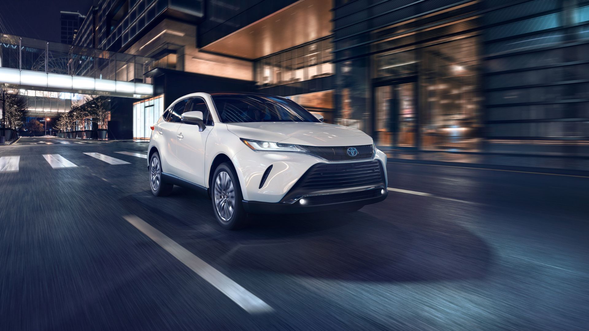 Dynamic front 3/4 shot of a white 2024 Toyota Venza Limited.