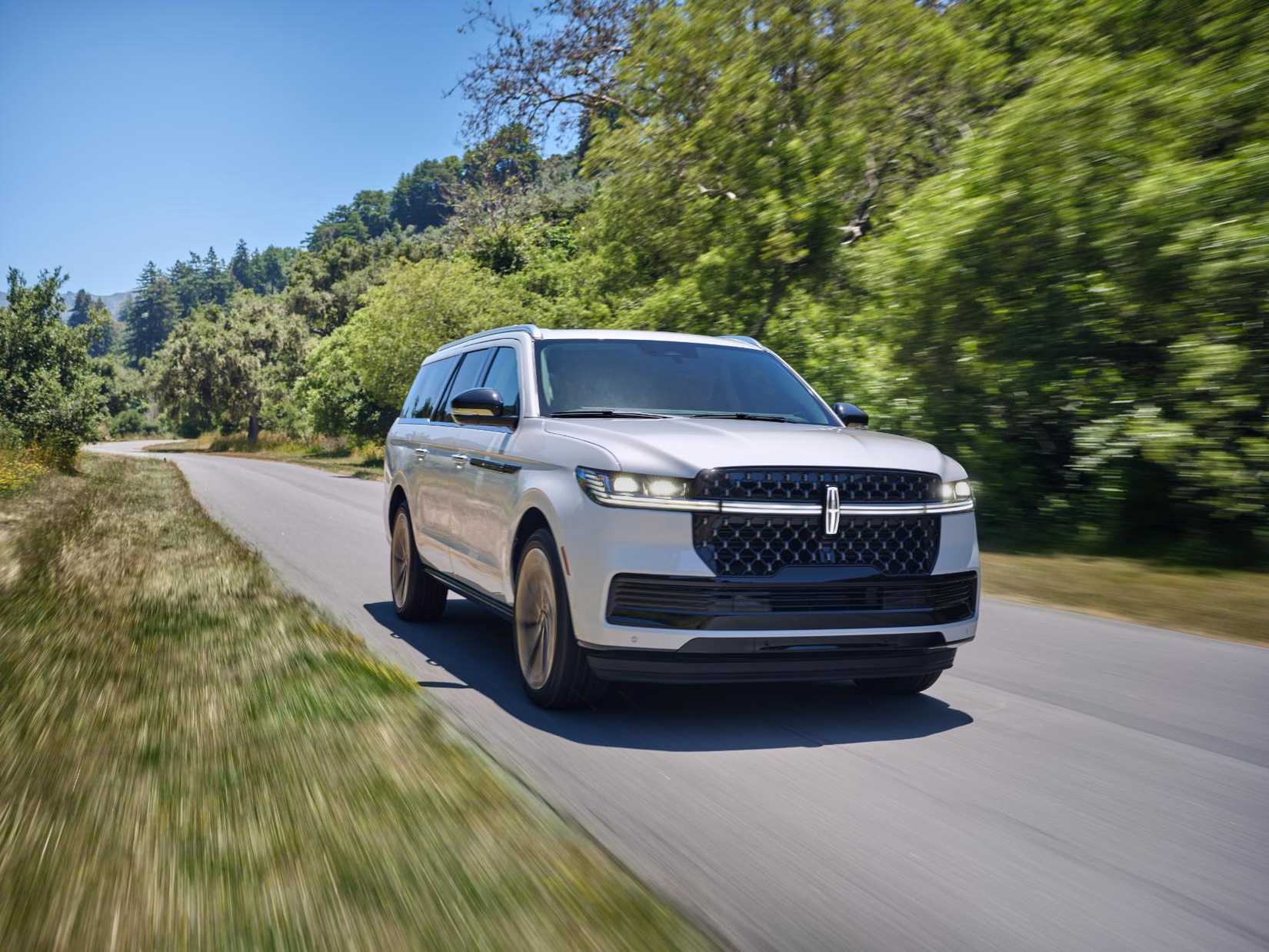 2025 Lincoln Navigator L Black Label Crystal White front profile while driving