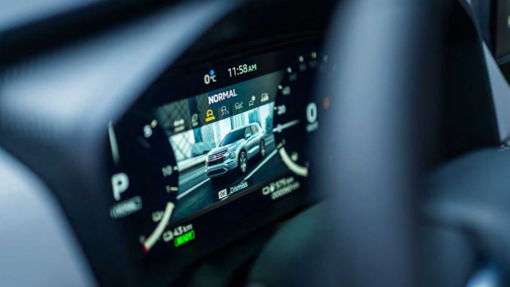 Close-up of the digital instrument cluster of a 2026 Mitsubishi Outlander PHEV.