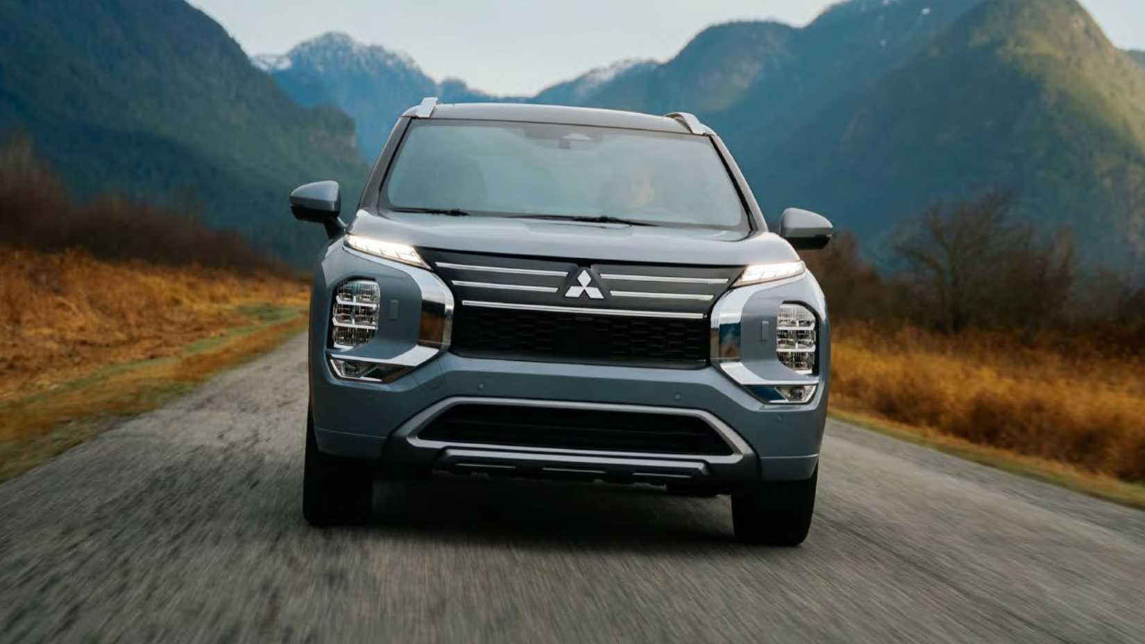 Dynamic front-end shot of a gray 2026 Mitsubishi Outlander PHEV.
