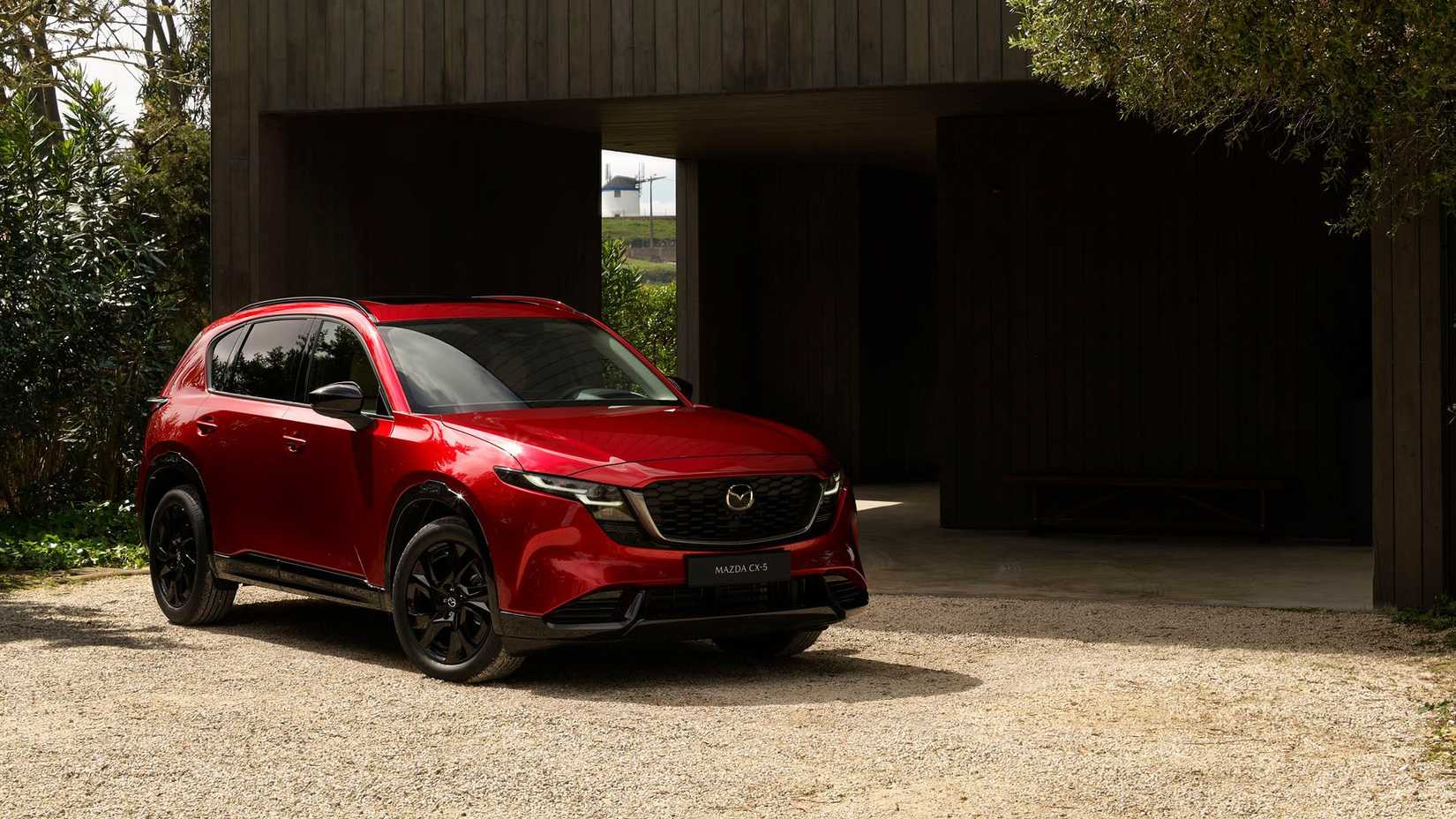 Static front 3/4 shot of a red 2026 Mazda CX-5.
