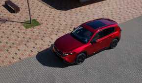Static overhead front 3/4 shot of a red 2026 Mazda CX-5.