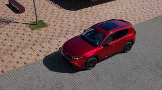 Static overhead front 3/4 shot of a red 2026 Mazda CX-5.