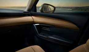 Close-up shot of the door trim inside the cabin of a 2026 Mazda CX-5.