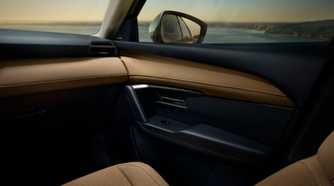 Close-up shot of the door trim inside the cabin of a 2026 Mazda CX-5.