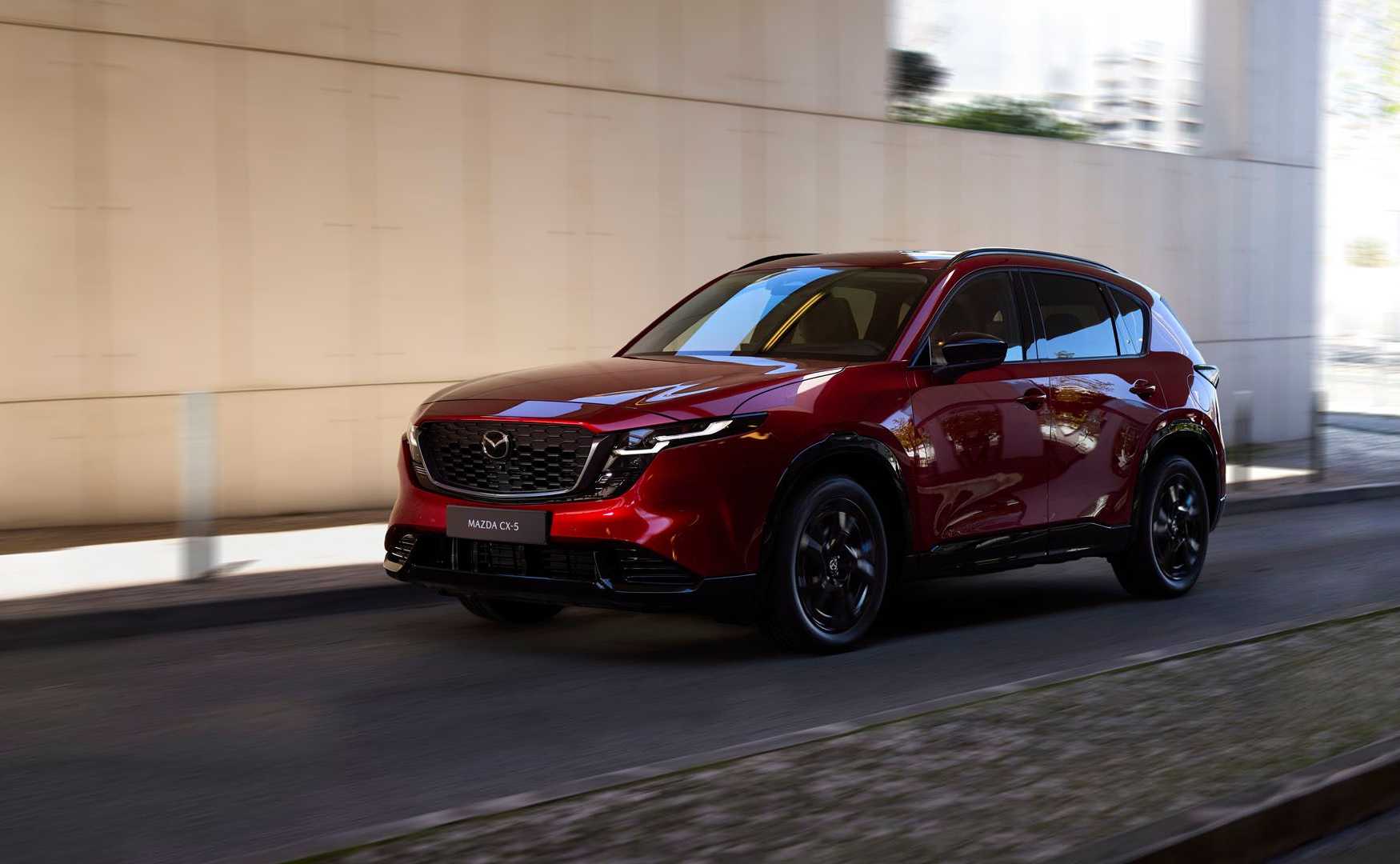 Dynamic front 3/4 shot of a red 2026 Mazda CX-5.