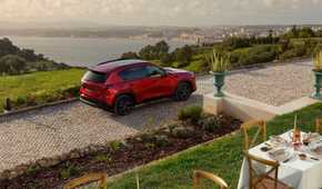 Static overhead rear 3/4 shot of a red 2026 Mazda CX-5.