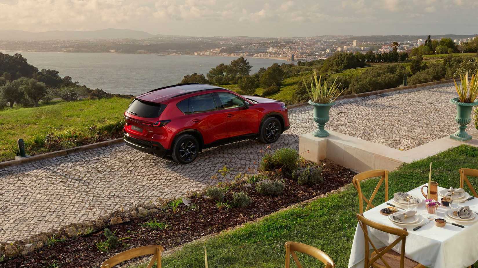 Static overhead rear 3/4 shot of a red 2026 Mazda CX-5.