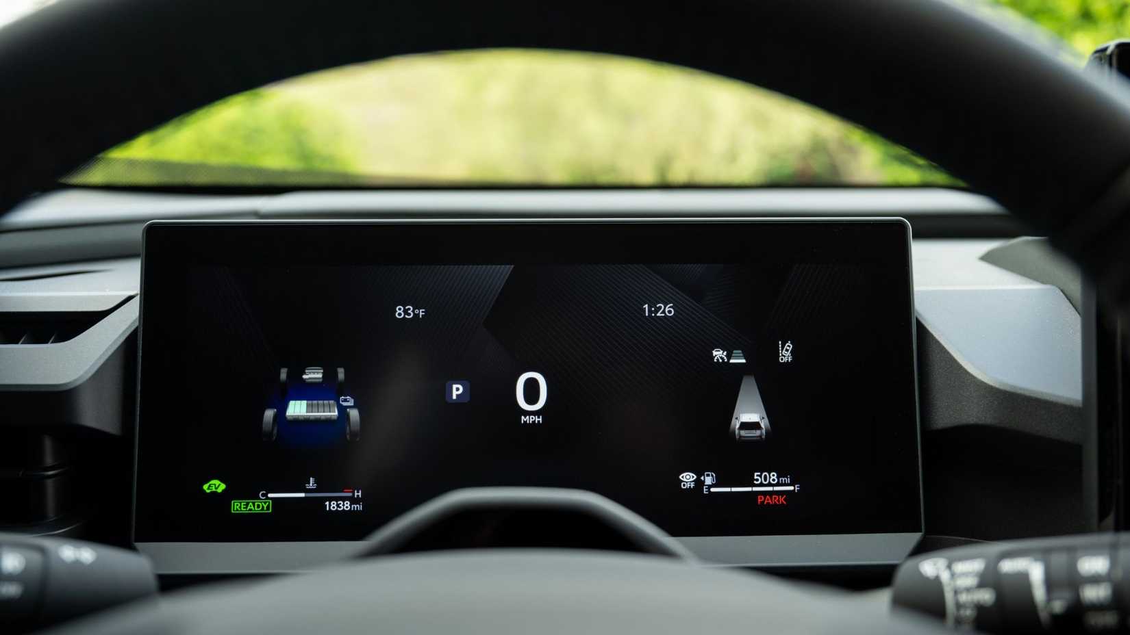 Close-up shot of the digital instrument cluster inside the cabin of a 2026 Toyota RAV4 HEV Limited.