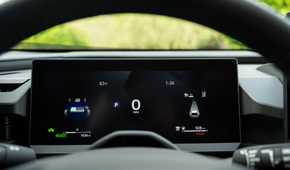 Close-up shot of the digital instrument cluster inside the cabin of a 2026 Toyota RAV4 HEV Limited.