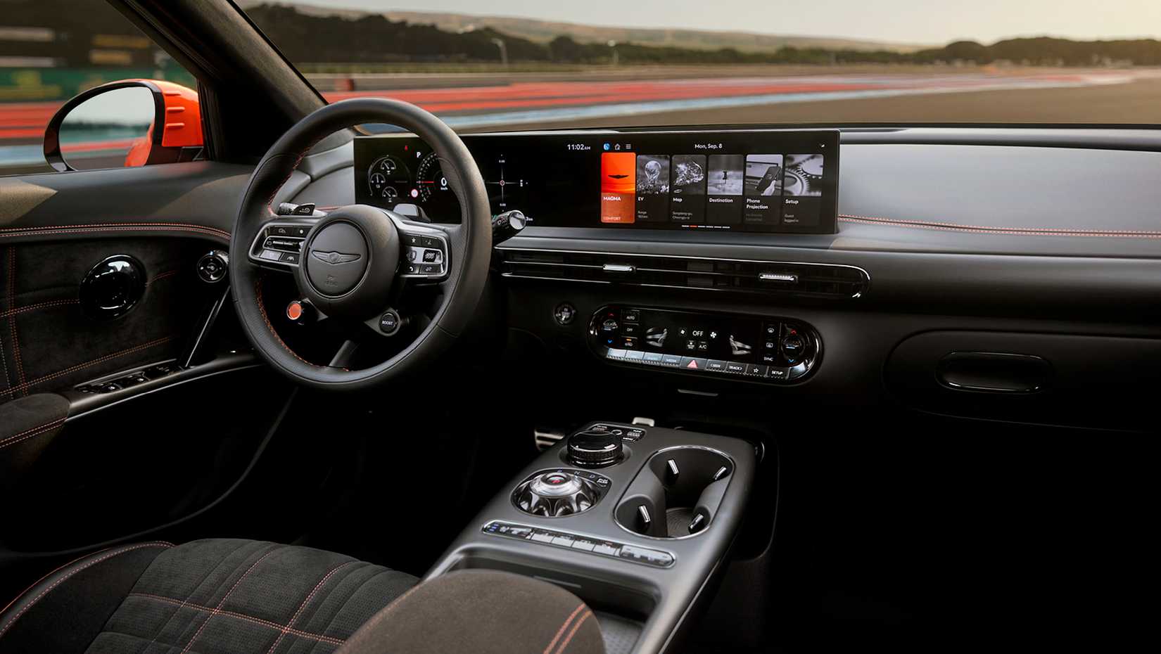 Салон Genesis GV60 Magma с видом на трек