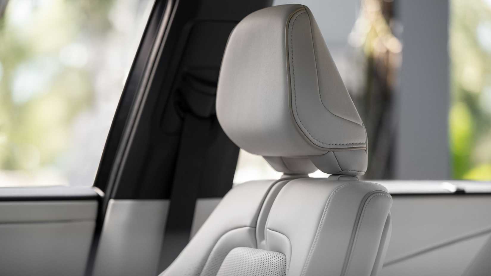 Close-up shot of the cream leather seat in a 2027 Toyota Highlander Limited.