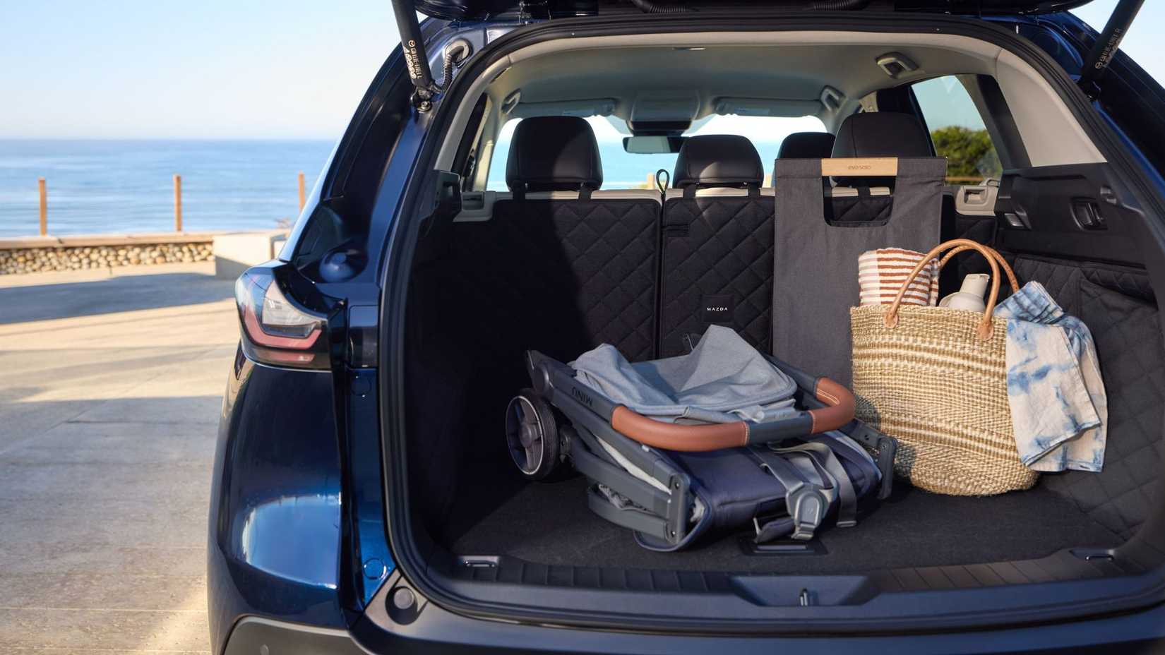 Shot of inside the trunk of a 2026 Mazda CX-5 filled with items.