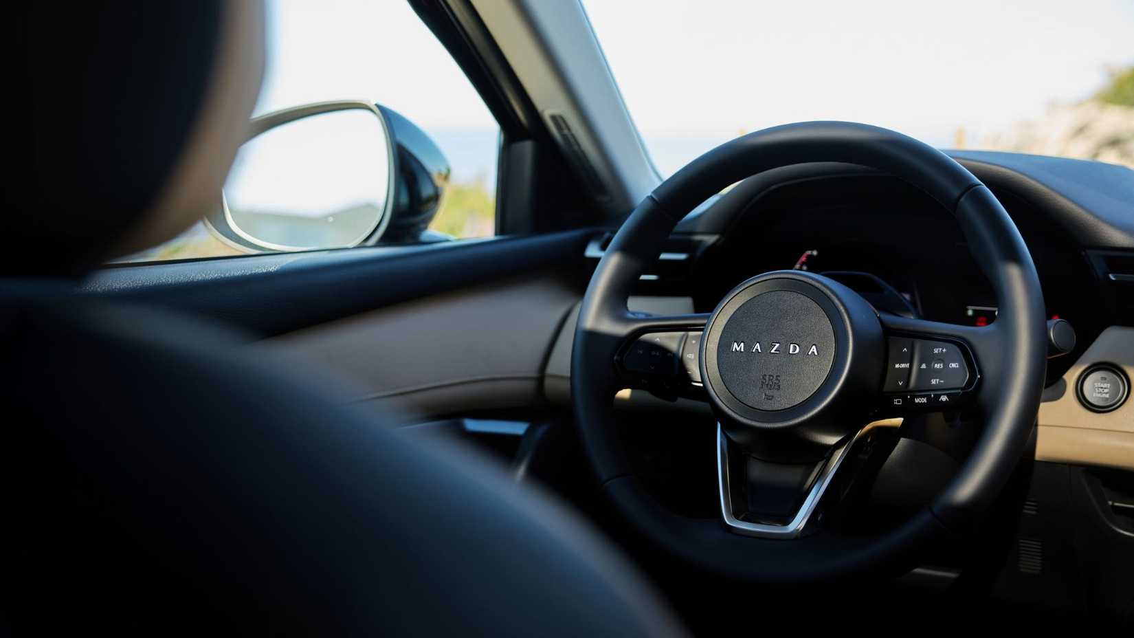 Close-up shot of the steering wheel in a 2026 Mazda CX-5.