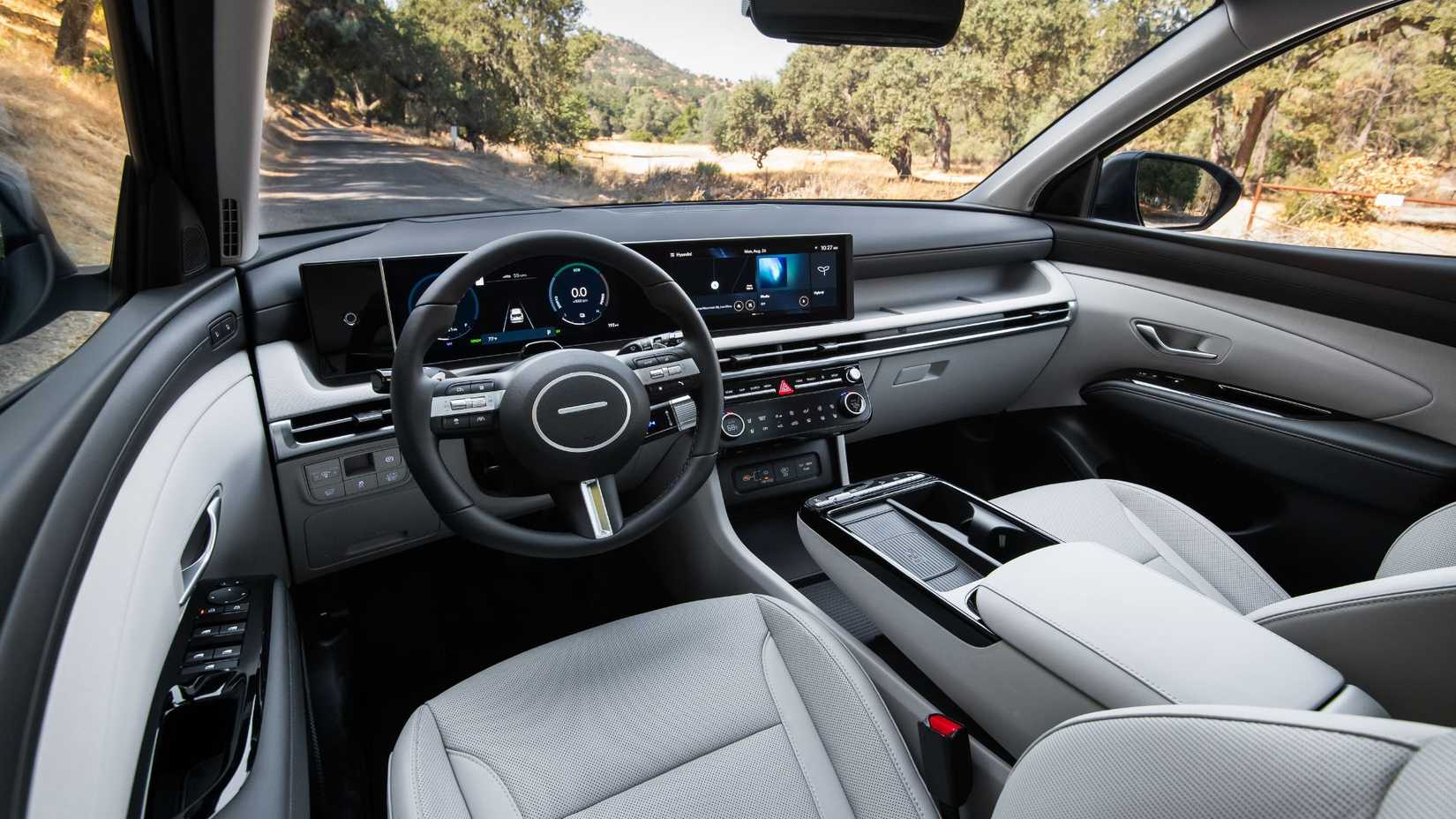 Shot inside the cabin of a 2026 Hyundai Tucson Hybrid, showing the interior and dashboard.